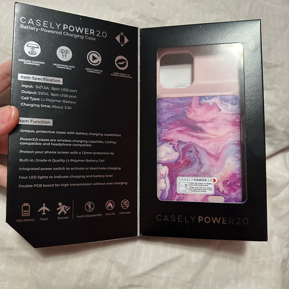 Casely Power 2.0 battery charging case for iPhone 12 Pro in purple tie dye.